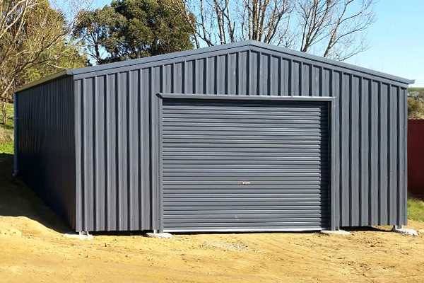 Gable roof double-width garage with single centred roller door